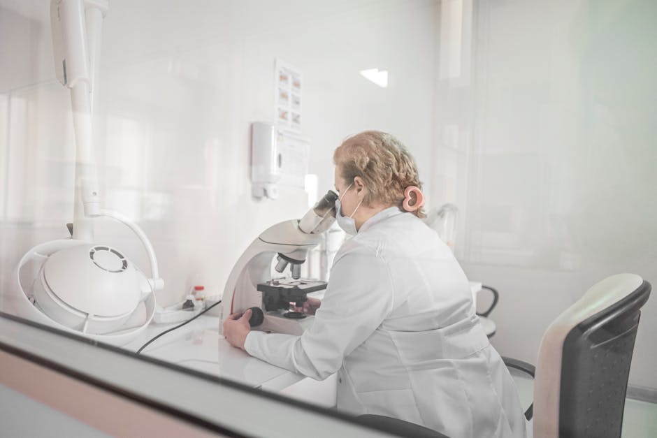 Laboratory scientist conducting mold microscopic analysis